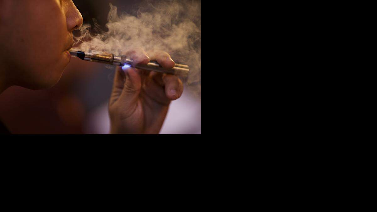 
Ken Miguel of San Jose puffs on an e-cigarette in 2013 at The Vape Bar in San Jose.
