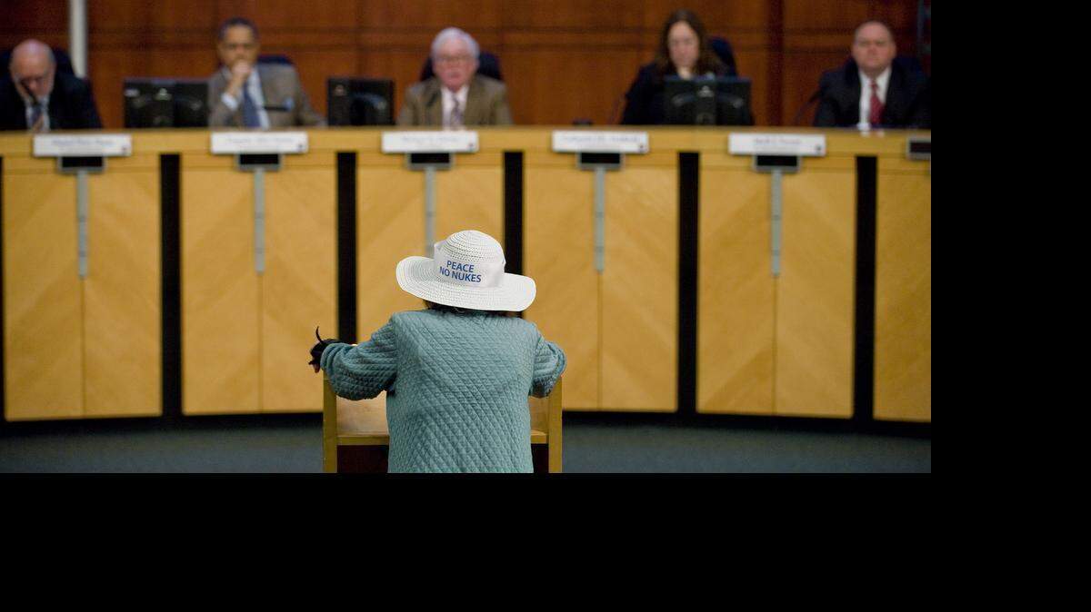 
Members of the California Public Utilities Commission listen to Lyn Harris Hicks of San Clemente a 2012 meeting in Irvine.
