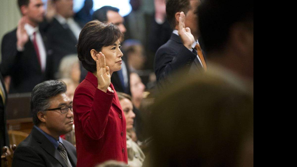 
Assemblywoman Young Kim, R-Fullerton, is sworn in on Dec. 1 at the state Capitol in Sacramento. Her family left South Korea when she was a girl, and now Kim is California’s first Korean American legislator, representing northern Orange County.
