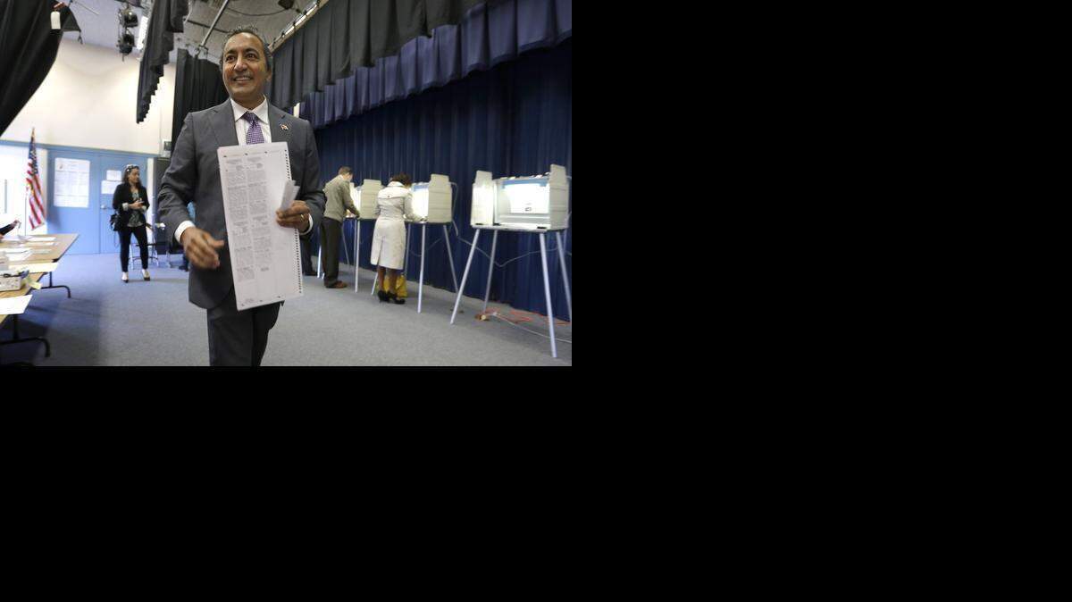 
Democratic Rep. Ami Bera goes to a cast his ballot while voting in Elk Grove on Tuesday. Bera is in a tight race with Republican Doug Ose for California’s 7th District, one of the most hotly contested congressional seats in the country.
