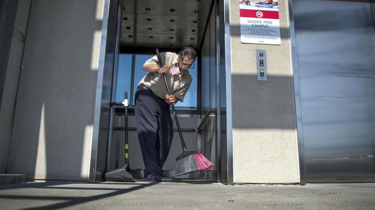 
Pete Amirani of Fair Oaks sweeps an elevator at the Lawrence J. Ellison Ambulatory Care Center, part of the UC David Medical Center, on July 23, 2015. Amarillo works with InAlliance, a Sacramento nonprofit that provides services to people who have developmental disabilities and receives funding from the state.
