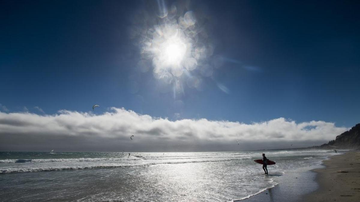 Windsurfers and kiteboarders ride the winds and waves of Waddell Beach on June 24, 2014.