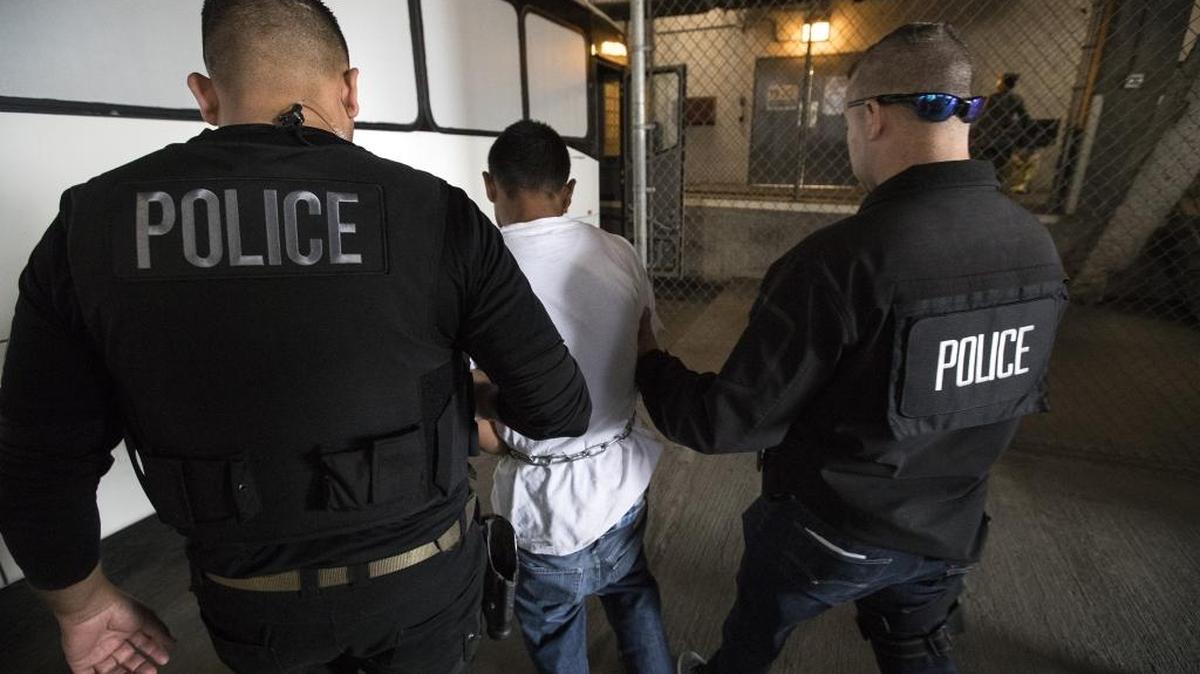 23-year-old Juan Vega is escorted by agents into the ICE downtown Los Angeles staging facility on April 18, 2017.
