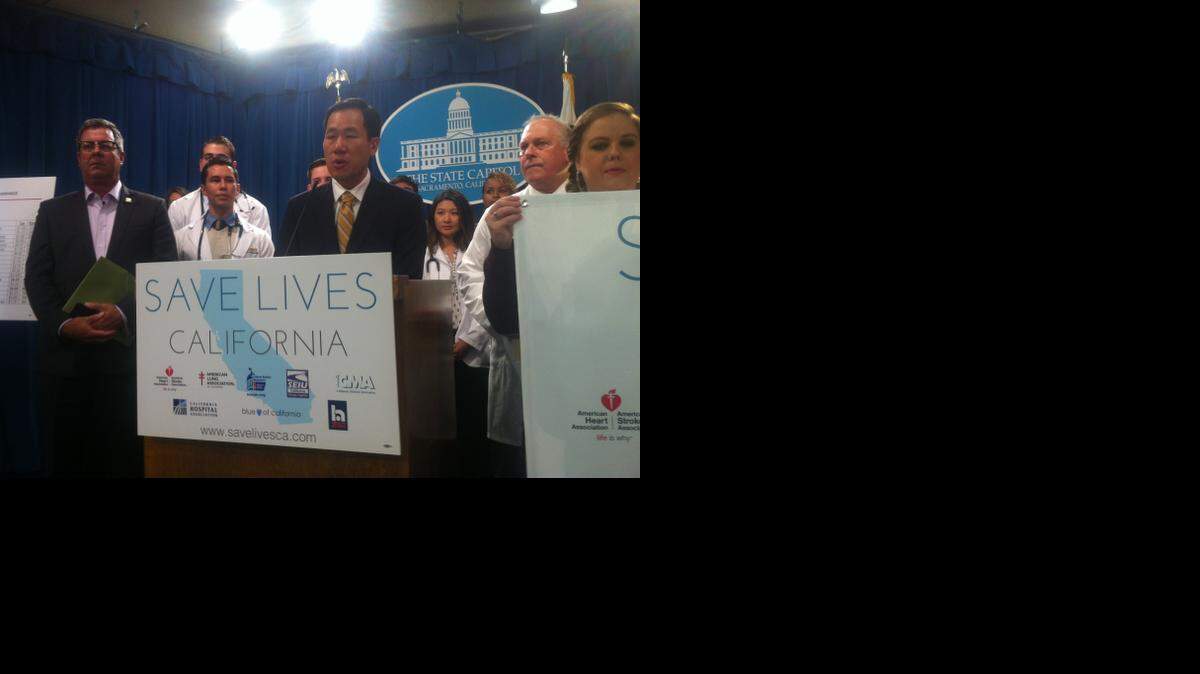 
Dr. Michael Ong and other advocates announce a tobacco tax campaign at a press conference in Sacramento, Calif. on Thursday, Nov. 20, 2014.
