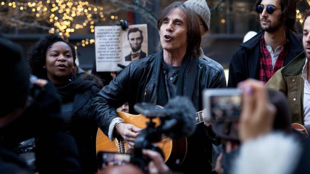 Singer-songwriter Jackson Browne, sings a few tunes for Occupy Wall Street protestors in New York City’s Zuccotti Park on Dec. 1, 2011.