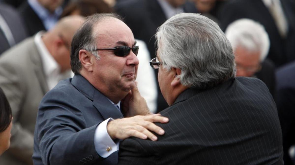 California State Sen. Ron Calderon, right, comforts his brother former state Assemblyman Tom Calderon at a memorial service for Tom’s wife Marcella Calderon at the Montebello Applied Technology Center High School in Montebello on January 14, 2012.
