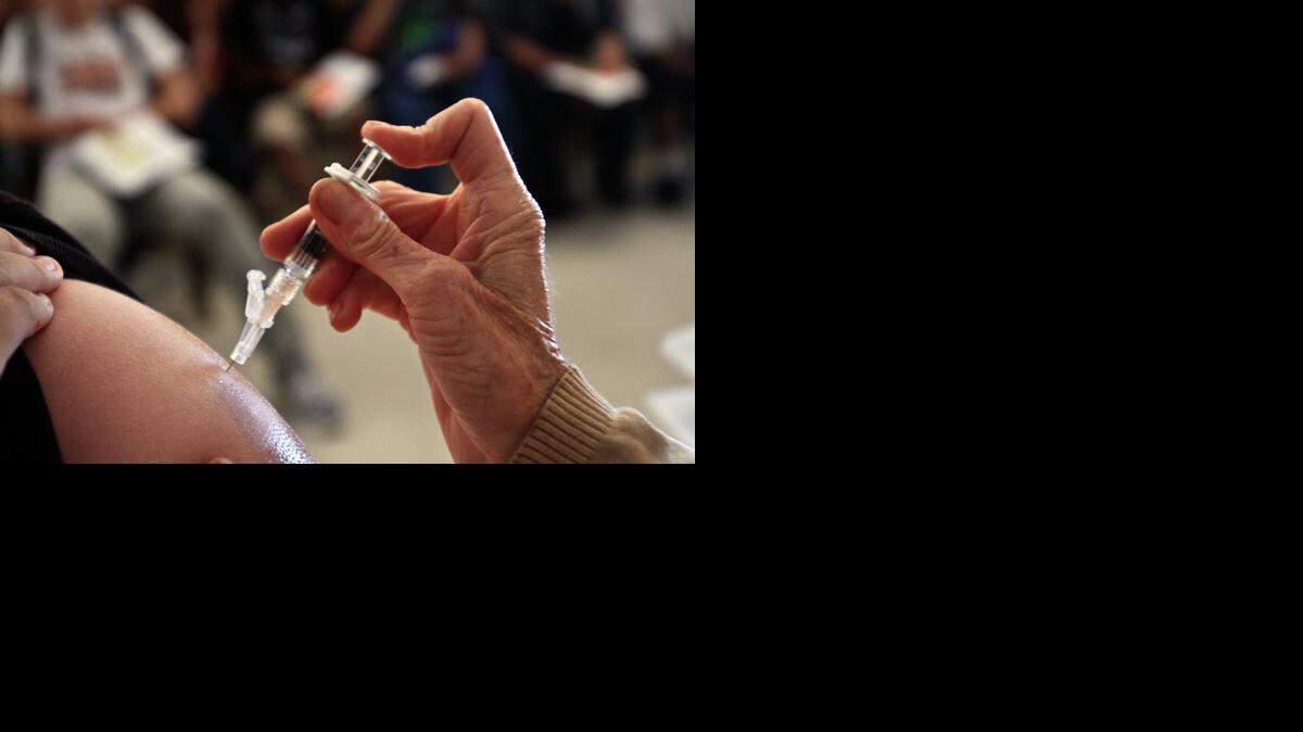 
Students at Huntington Park high school get whooping cough shots on July 6, 2011.
