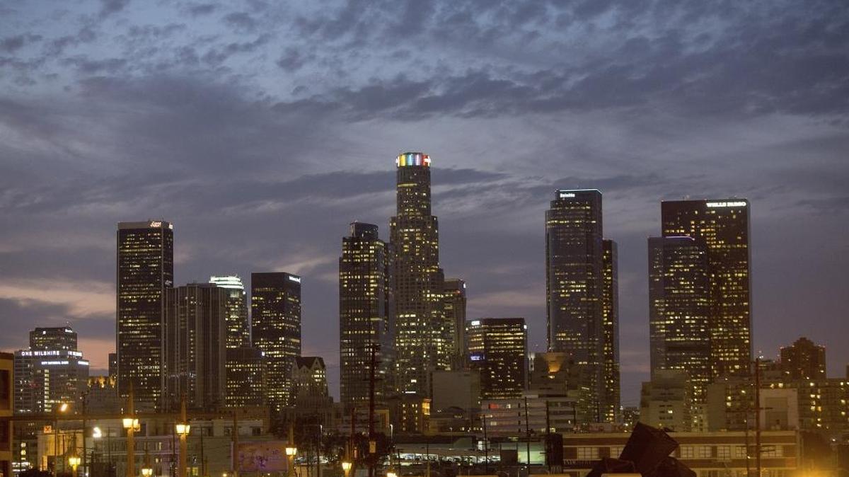 Los Angeles, whose downtown is shown in this 2014 photo, is the largest of 77 California cities declared to be “economically challenged” in a new study, more than a quarter of the nation’s cities in that condition. They are marked by low incomes and high unemployment and poverty rates.