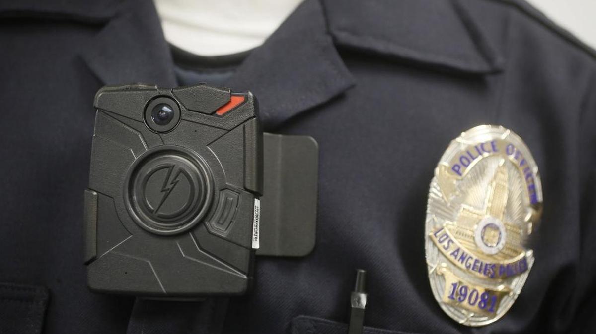 In this Jan. 15, 2014 file photo a Los Angeles Police officer wears an on-body camera during a demonstration in Los Angeles.