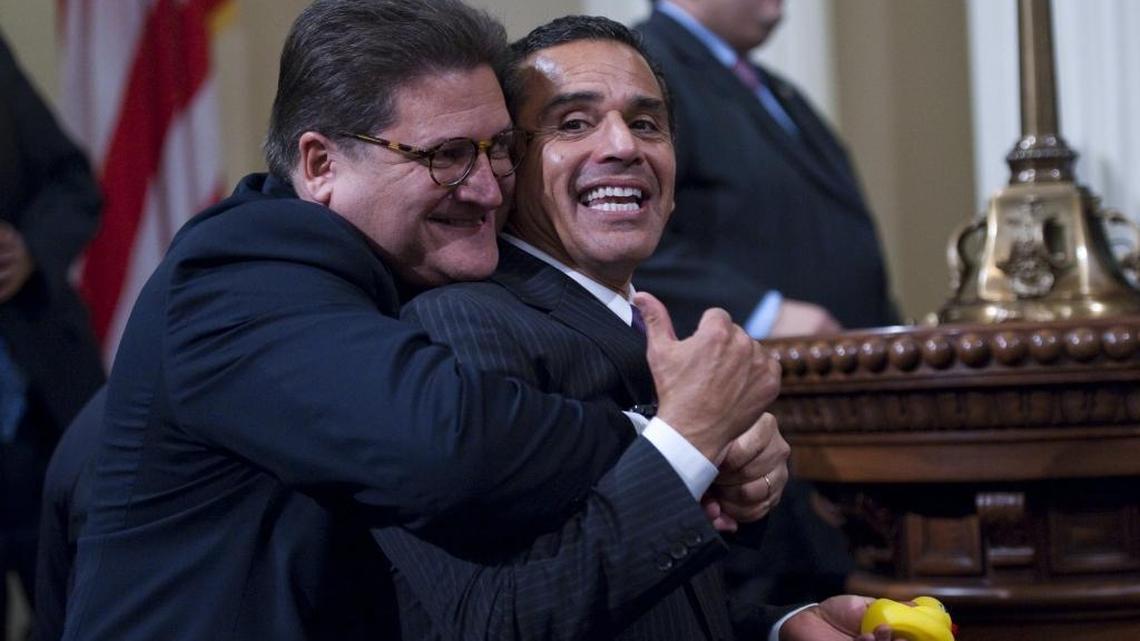 Robert Hertzberg, gives Los Angeles Mayor Antonio Villaraigosa, a hug as Assemblyman John A. Perez prepares to be sworn in as the 68th speaker on Monday, March 1, 2010 at the Capitol.