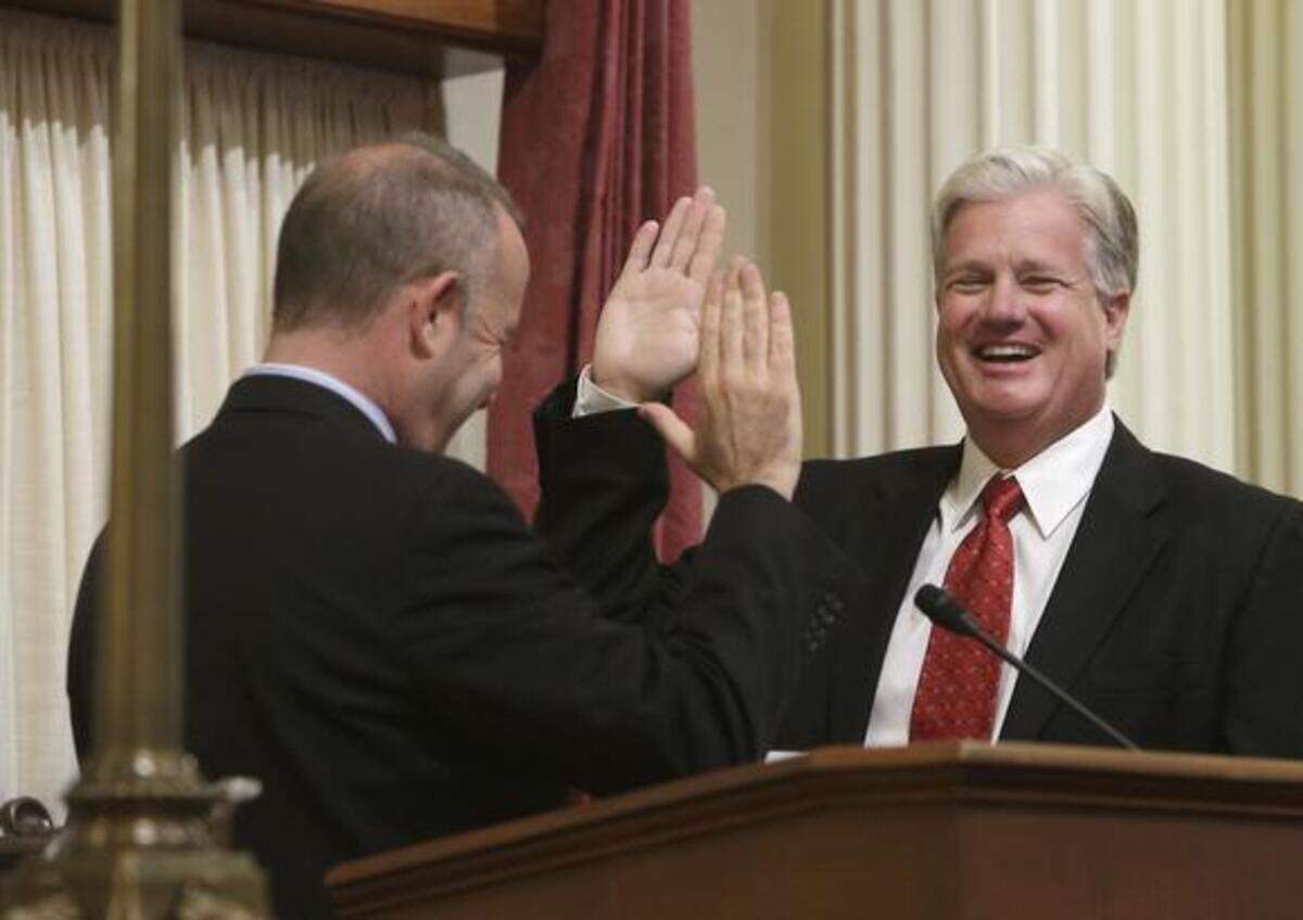 
Andy Vidak, R-Hanford, right, laughs in a light-hearted moment as he is given the ceremonial oath of office by Senate President Pro Tem Darrell Steinberg, D-Sacramento, at the Capitol on Aug. 12, 2013. 
