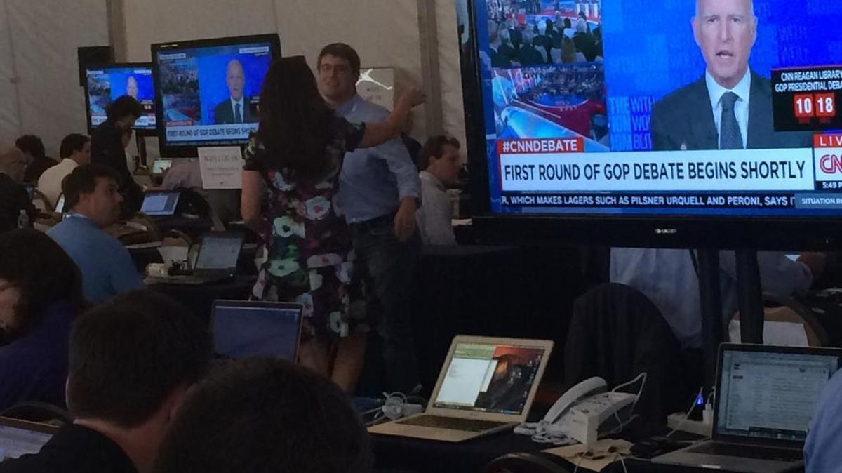 
Gov. Jerry Brown speaks on CNN, shown on a monitor at Wednesday’s Republican presidential debate in Simi Valley.
