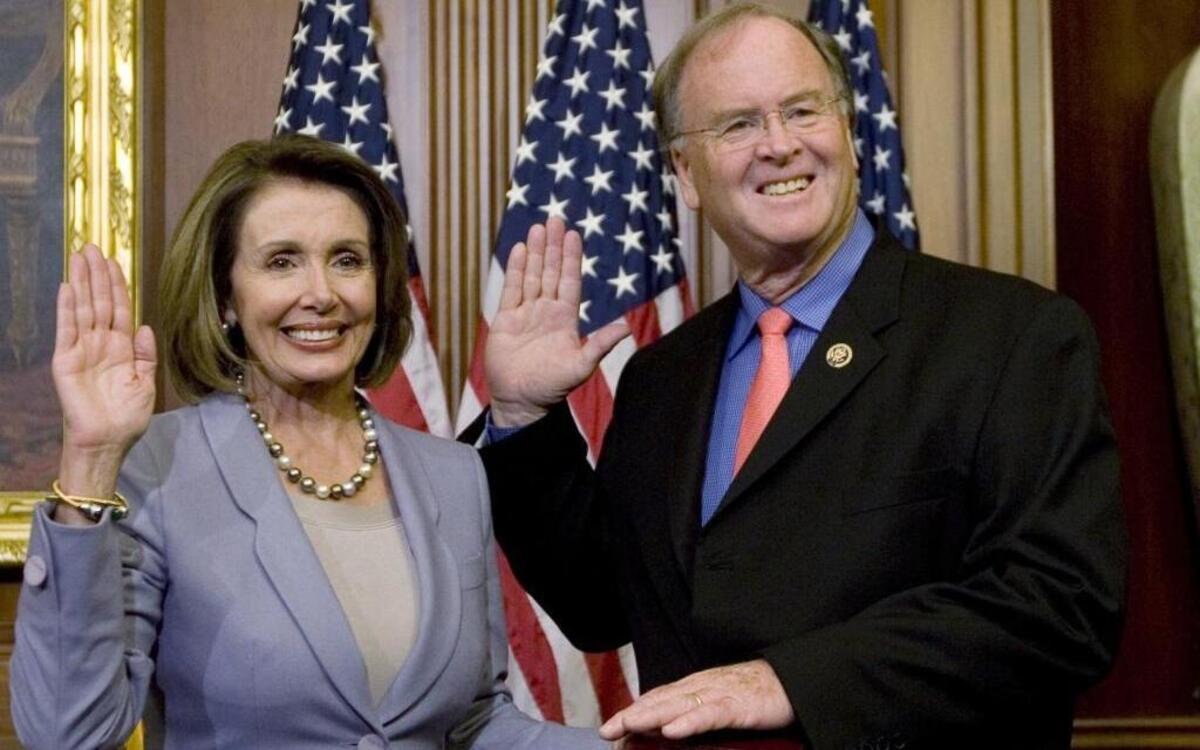 In this 2009 photo, House Speaker Nancy Pelosi of Calif., left, stands with Rep. Sam Farr, D-Calif., during a mock swearing-in on Capitol Hill. Farr said Monday he will retire at the end of his current term.