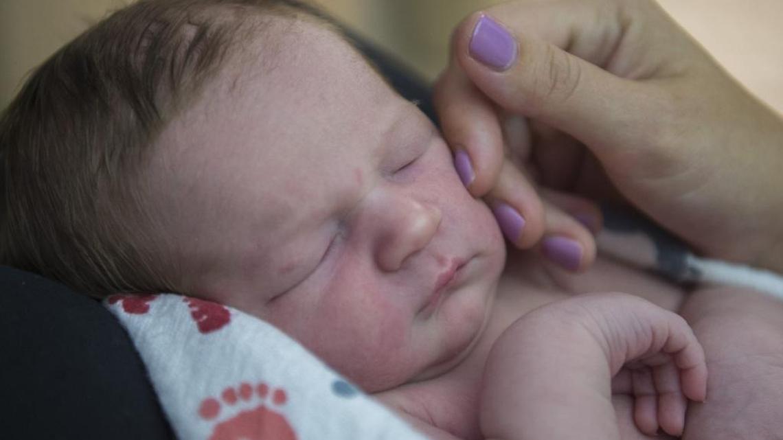 Rockland resident Amanda Mackey softly touches the cheek of her son, 1-day old Beckett Mackey at Sutter Davis Hospital on Aug. 1, 2017 in Davis.