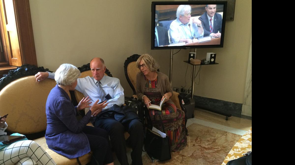 
Gov. Jerry Brown and his executive secretary, Nancy McFadden (right), speak with Laurence Tubiana, a representative of the French government on climate change, in Vatican City on July 22, 2015.
