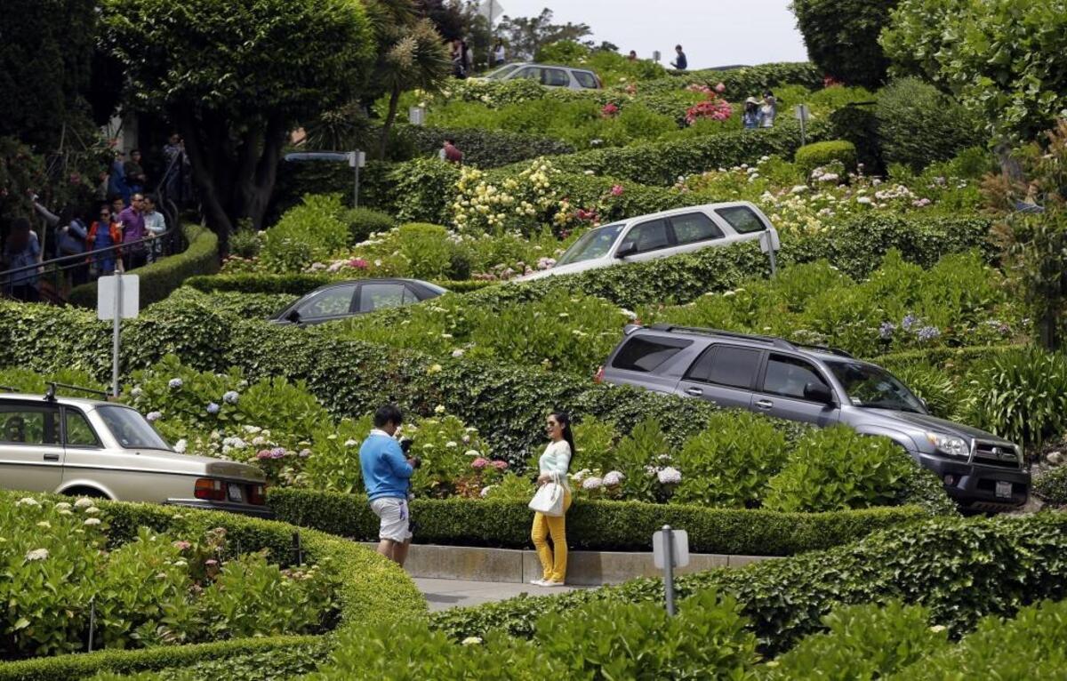 Motorists make their way down famously crooked Lombard Street in San Francisco in 2014.