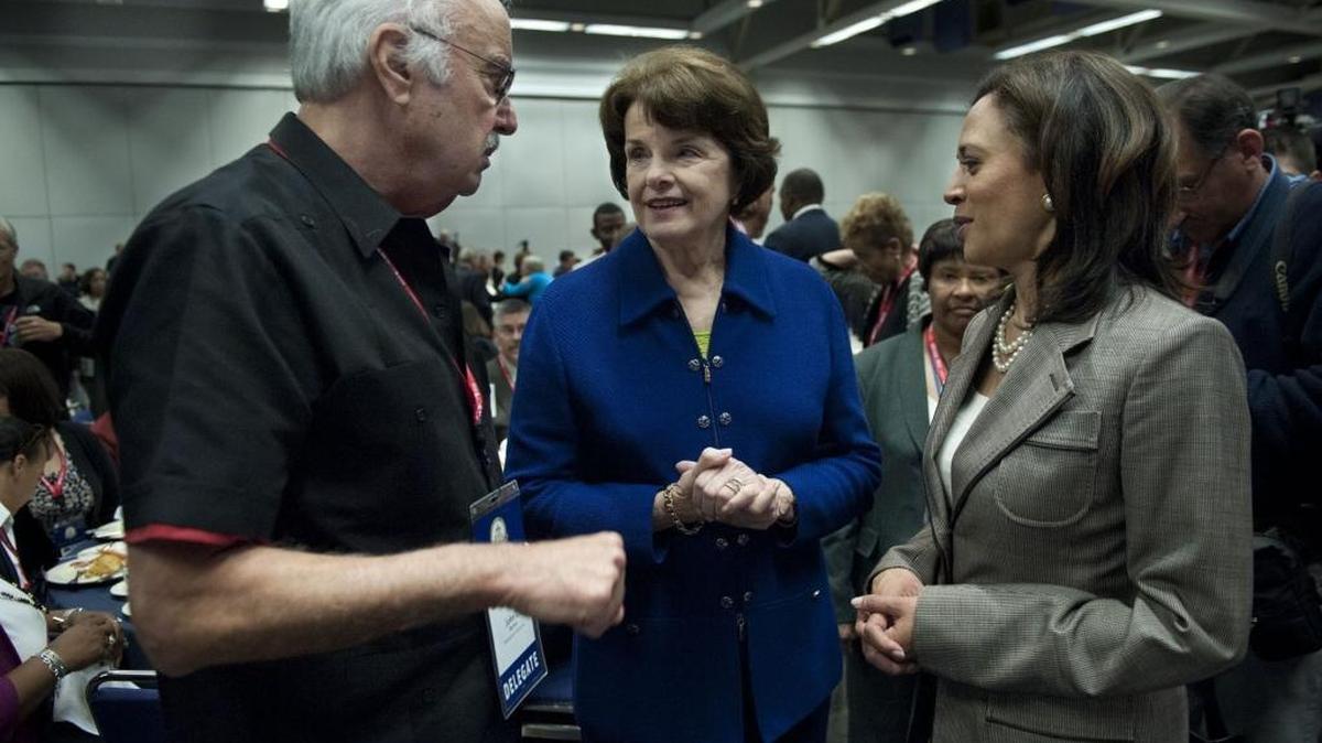 California Democratic Party Chairman John Burton, left, talks with Sen. Dianne Feinstein and then-Attorney General Kamala Harris after her remarks to Democratic delegates on Saturday, April 30, 2011 at the Sacramento Convention Center.
