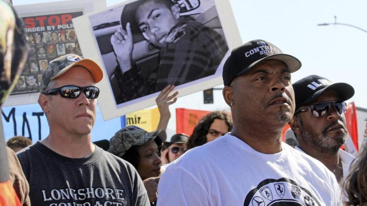 
Longshoremen listen to speakers during an Oakland protest against police brutality earlier this year. An advocacy group will hold a Capitol rally today to for an end to racial profiling and mass incarceration.
