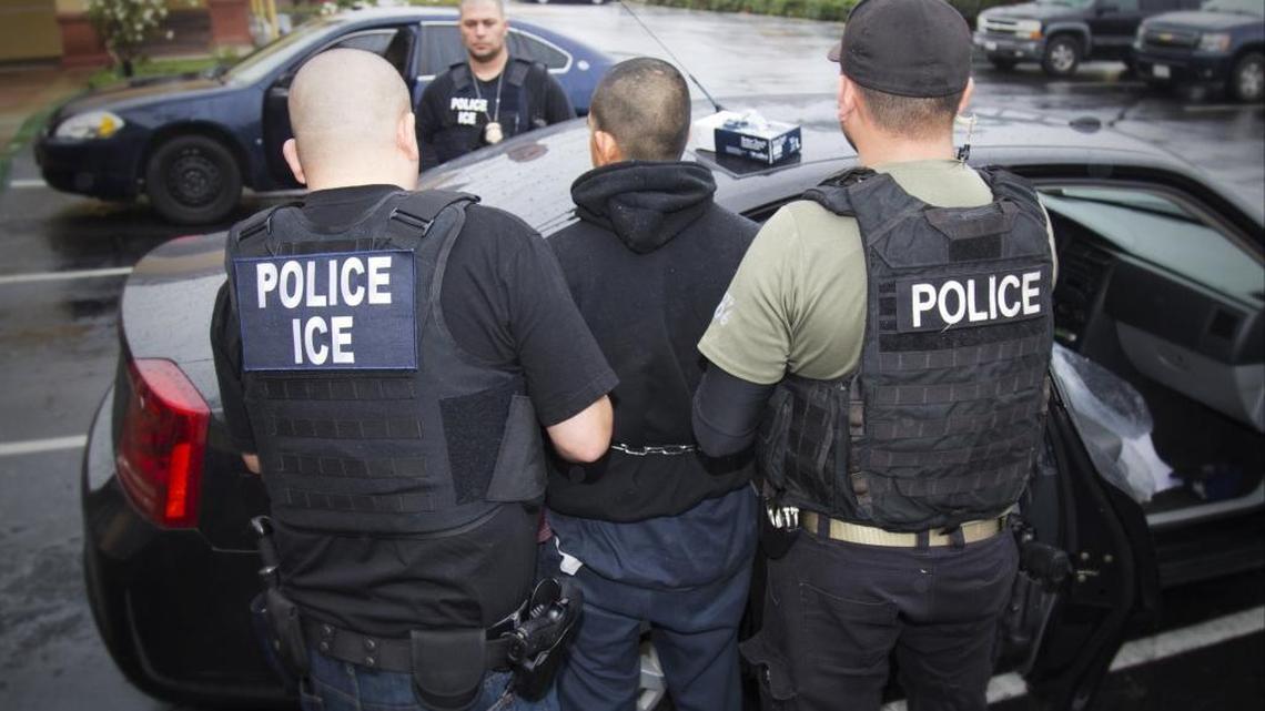 U.S. Immigration and Customs Enforcement (ICE) officers make arrests in Los Angeles in February. The chief justice of California’s Supreme Court has asked federal authorities to desist from arresting suspected illegal immigrants at courthouses in the state.
