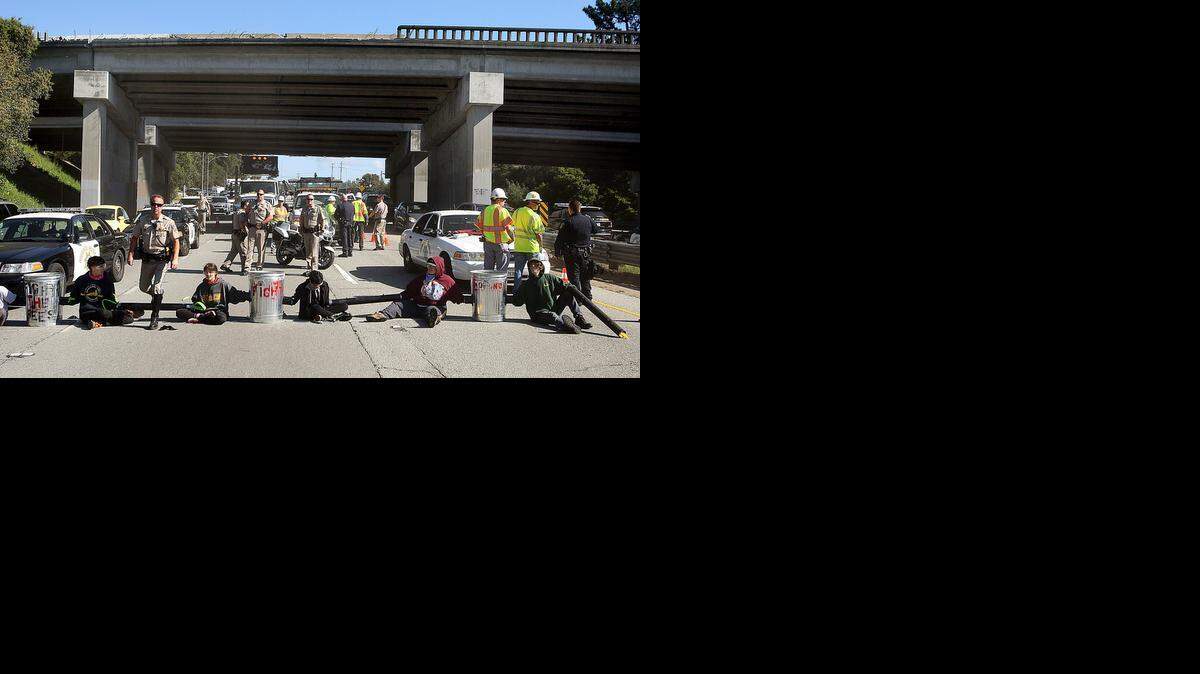  University of California, Santa Cruz, students block traffic Tuesday to protest proposed tuition hikes. The UC also proposes increasing out-of-state students.