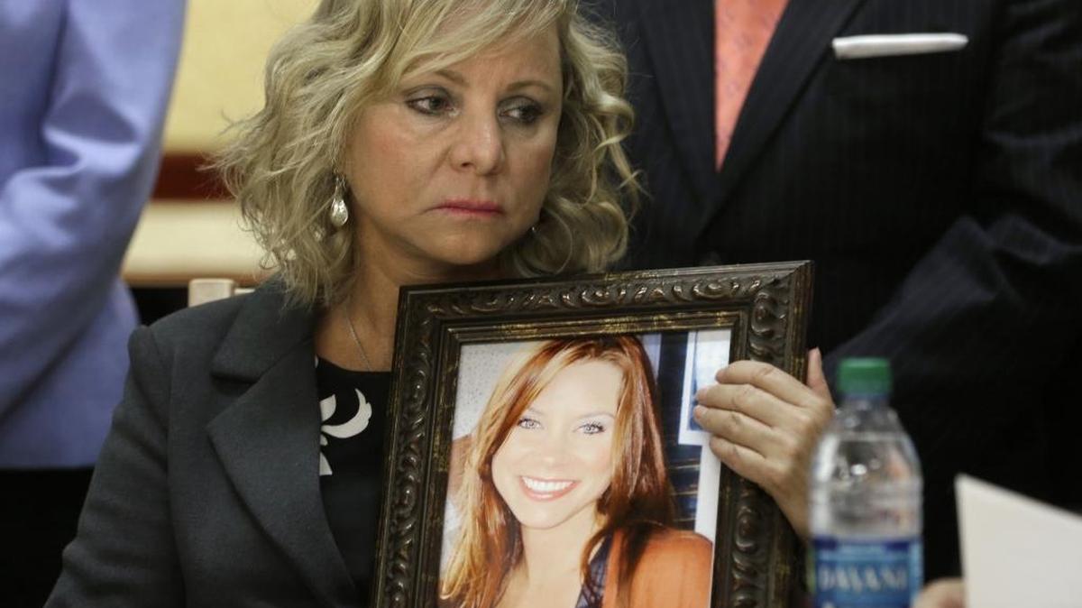 
Debbie Ziegler holds a photo of her daughter, Brittany Maynard, the California woman with brain cancer who moved to Oregon to legally end her life last fall, during a news conference to announce the reintroduction of right to die legislation on Aug. 18, 2015.
