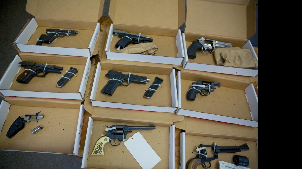 
Firearms evidence is on display in 2013 during a news conference in Portland, Ore.
