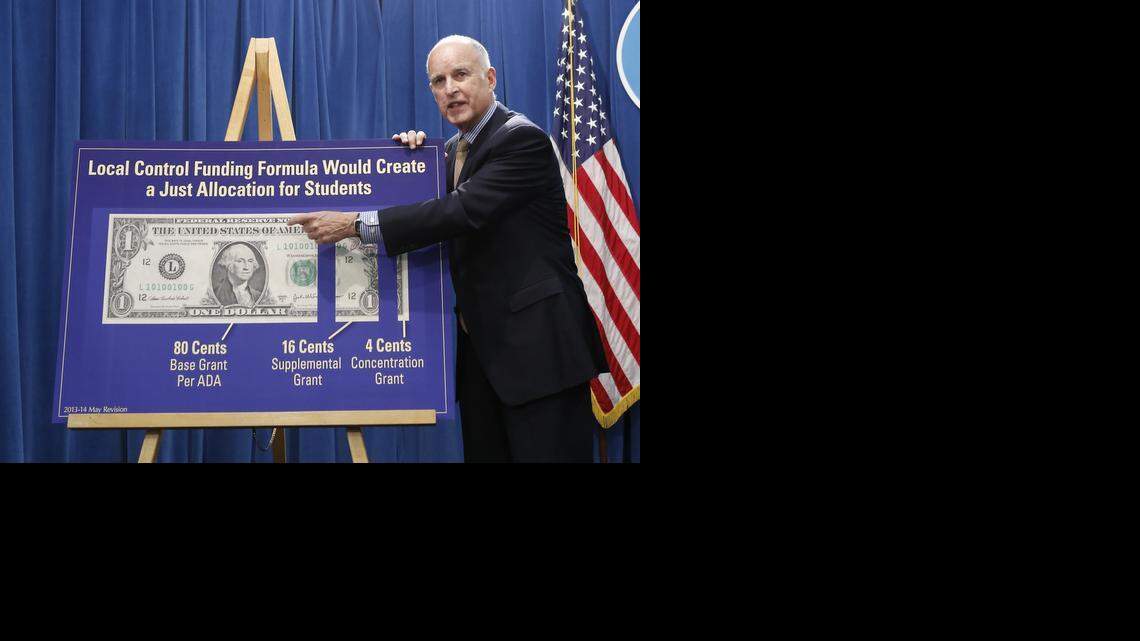 
Gov. Jerry Brown gestures to a chart as he discusses his revised 2013-14 state budget plan at the Capitol in Sacramento in May 2013. 


