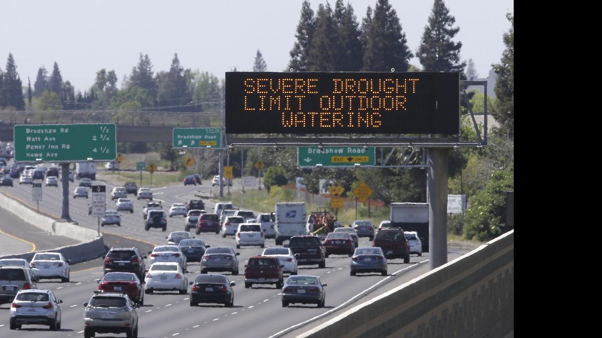 
Motorists pass a sign, Thursday, April 2, 2015, in Rancho Cordova, Calif., reminding them to reduce water use due to the statewide drought, as they drive on Highway 50. The state’s increasing population coupled with drought are putting new pressure on the water supply.
