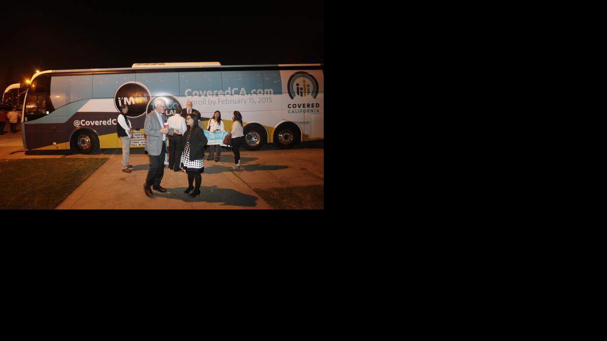 
A bus is painted with signs supporting Covered California during a promotional stop last fall in San Jose.
