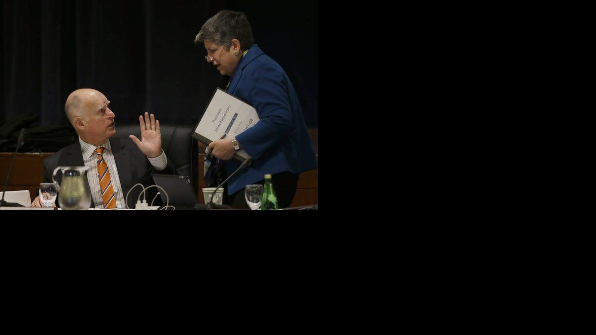 
Gov. Jerry Brown, left, greets University of California President Janet Napolitano during a UC Board of Regents meeting Wednesday in San Francisco.
