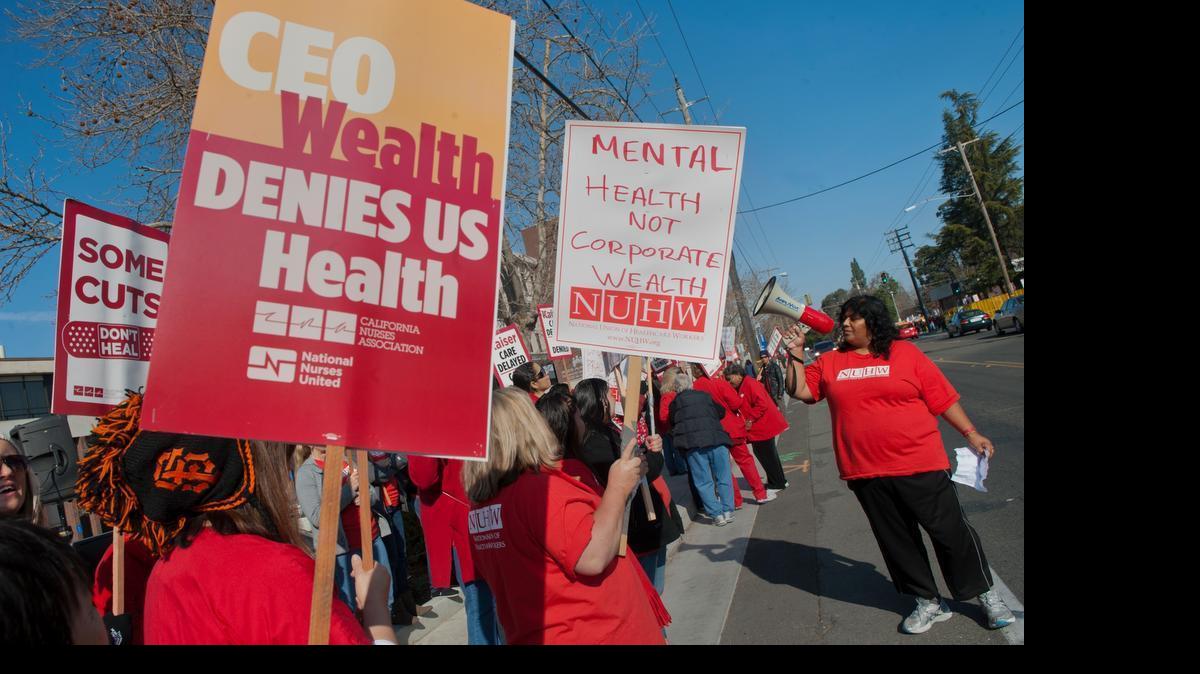
Medical workers represented by the National Union of Healthcare Workers are joined on apicket line by California Nurses Association nurses in a one-day strike outside a Kaiser Permanente hospital in Sacramento in 2012.
