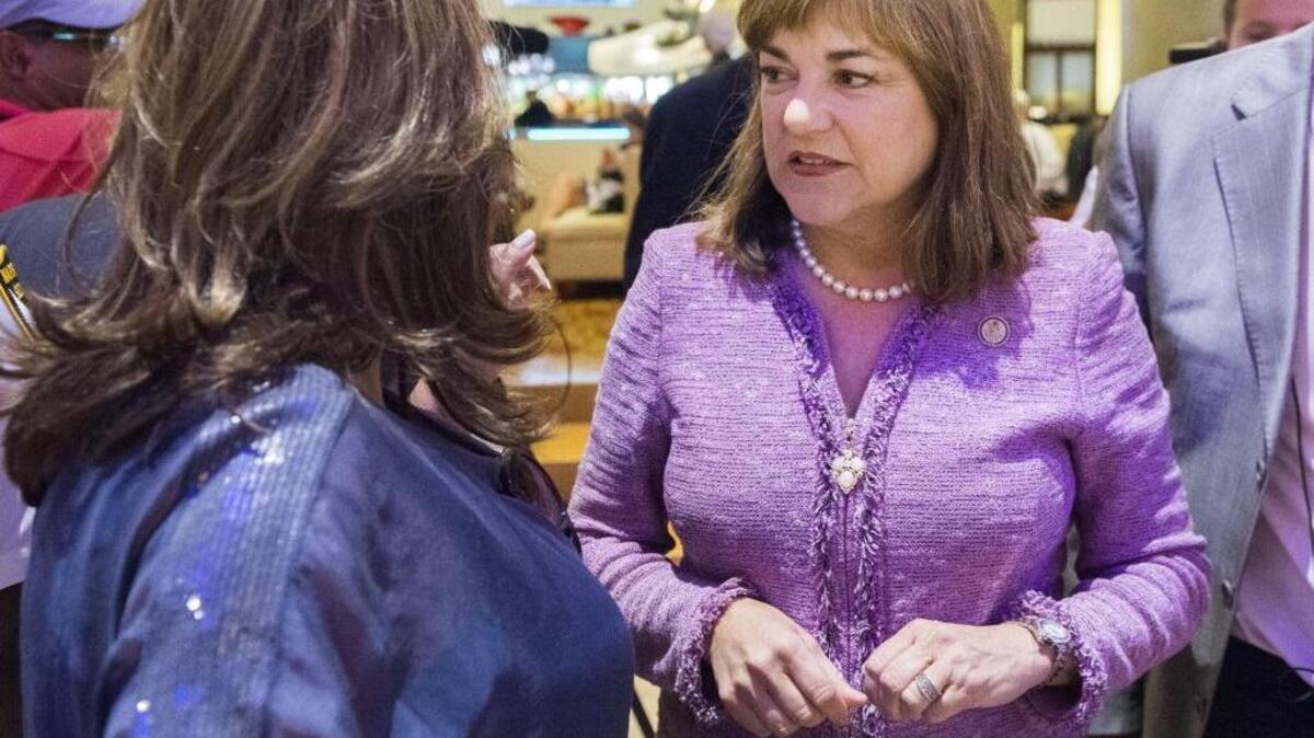 U.S. Senate candidate Loretta Sanchez chats with activists in the lobby of the Marriott Hotel in Philadelphia.