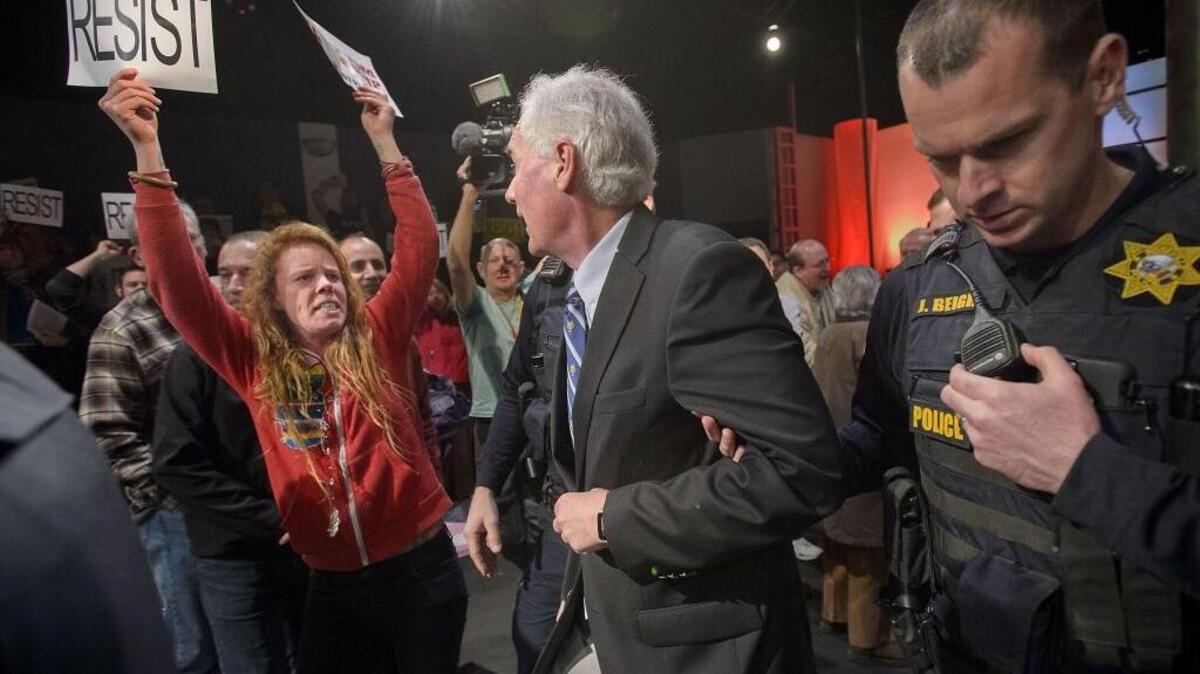 Roseville police escorted Republican congressman Tom McClintock from a packed town hall meeting on Feb 4, 2017.