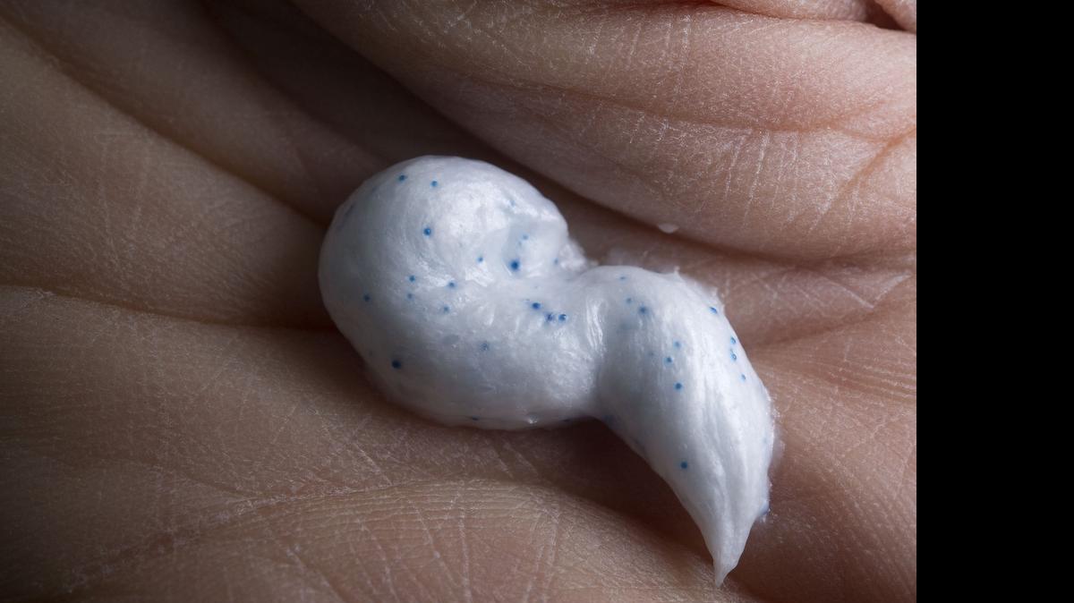 
Researcher Chelsea Rochman holds a dollop of commercially available facial scrub containing microbeads in her lab at UC Davis in Davis on Wednesday, April 15, 2015. 
