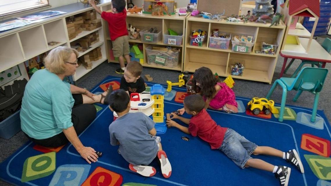 Resource teacher Sally Evey, left, works with Headstart students at Washington Elementary School in downtown Sacramento, Calif. on Wednesday, August 21, 2013.