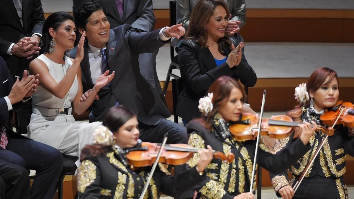 Lluvia Carrasco, left, joins her father, Sen. Kevin de León, as he celebrates becoming head of the California Senate at the Walt Disney Concert Hall in downtown Los Angeles on Oct. 15, 2014.