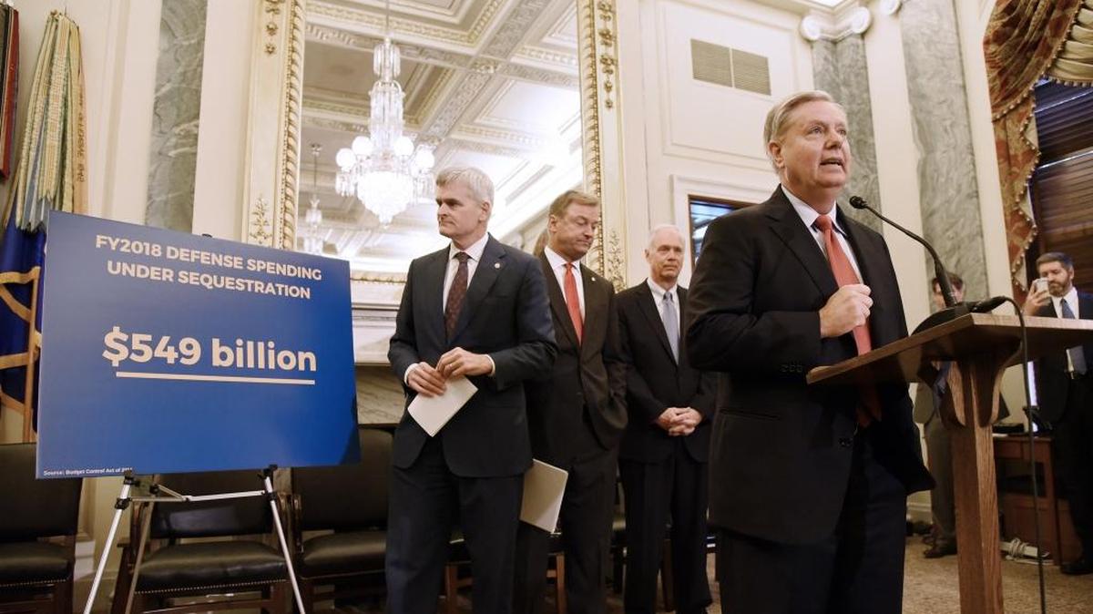 U.S. Sen. Lindsey Graham, R-S.C., speaks as Sen. Bill Cassidy, R-La., Sen. Dean Heller, R-Nev., Sen. Ron Johnson, R-Wis., listen during a news conference on health care on Wednesday, Sept. 13, 2017 in Washington, D.C.