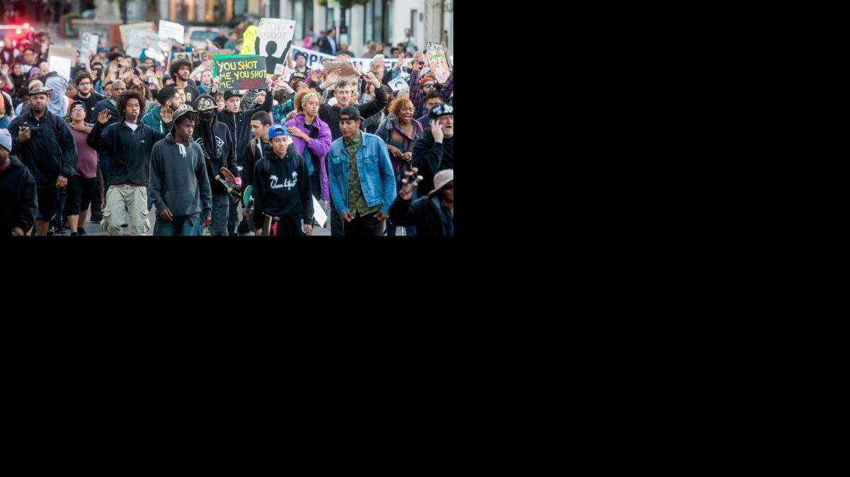 
This Aug. 20, 2014 file photo several hundred demonstrators march through Oakland, Calif. protesting the police shooting of unarmed black 18-year old Michael Brown in Ferguson, Mo. The San Francisco Bay Area's three largest police unions publish an "open letter" saying recent the anti-police rhetoric demonstrations have reached dangerous levels. 
