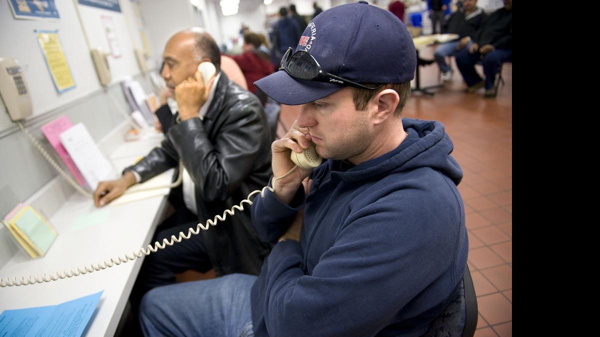 
Richard Dziedzic, 28, of Elk Grove, speaks to an Employment Development Department employee after having spent two six-hour days trying to get through to EDD in 2009. Unemployment rolls and unemployment insurance claims soared during the Great Recession, and the state still owes the federal government $8 billion from loans to shore up its Unemployment Insurance Fund.
