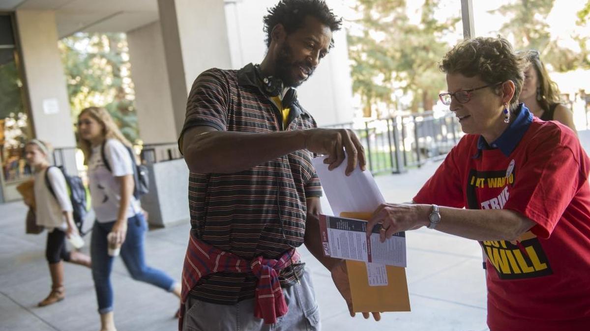 Robert Crawford, a math learning skills teacher at Sacramento State, votes on whether to authorize a faculty strike on Oct. 20, 2015.