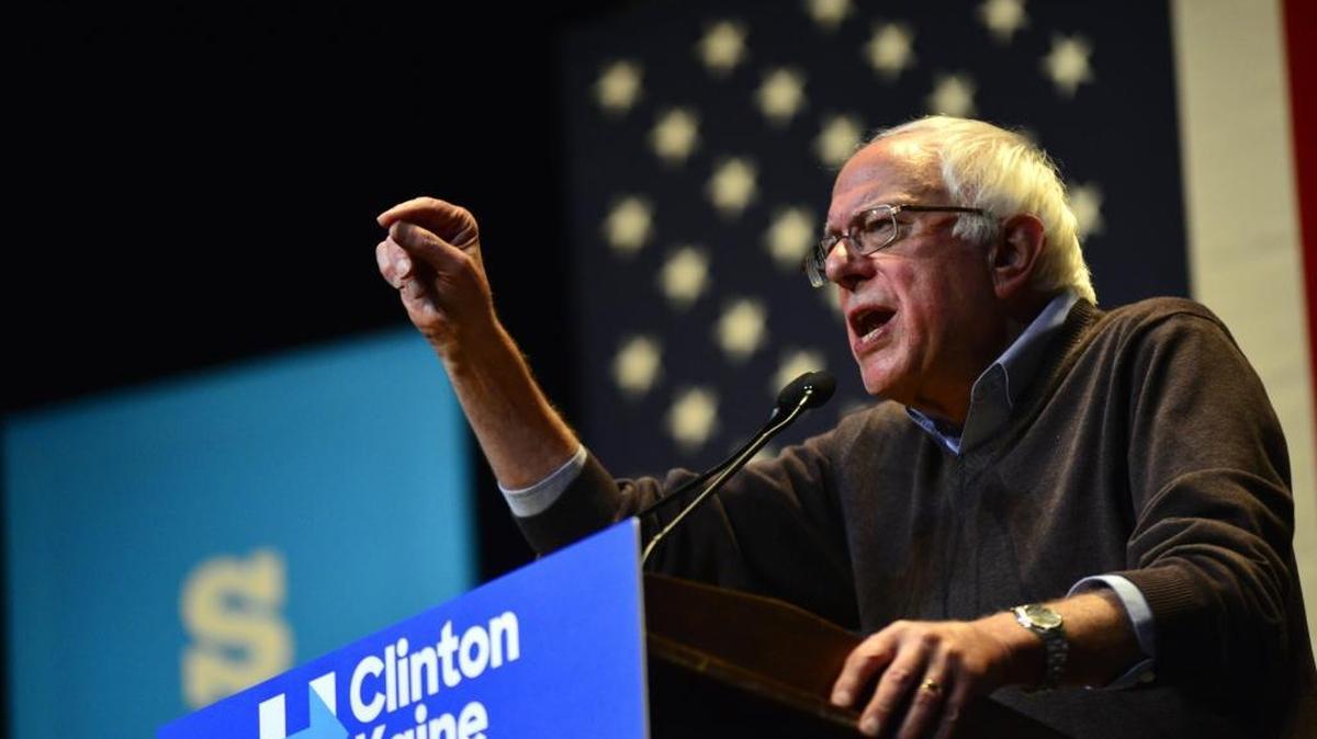 Sen. Bernie Sanders talks about making public colleges free during a rally for presidential candidate Hillary Clinton at Keene State College in Keene, N.H., on Friday.