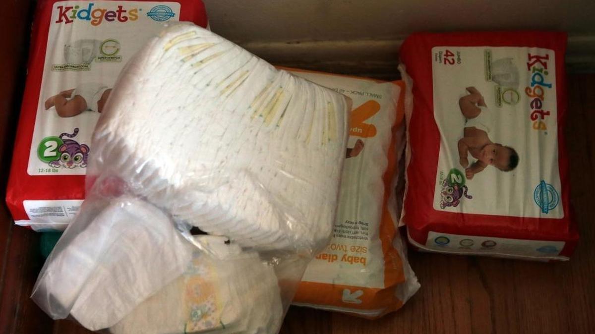 One mother relies on donated diapers from a help agency as well as family and friends for her son with health issues, Byron, in St. Louis, Mo.