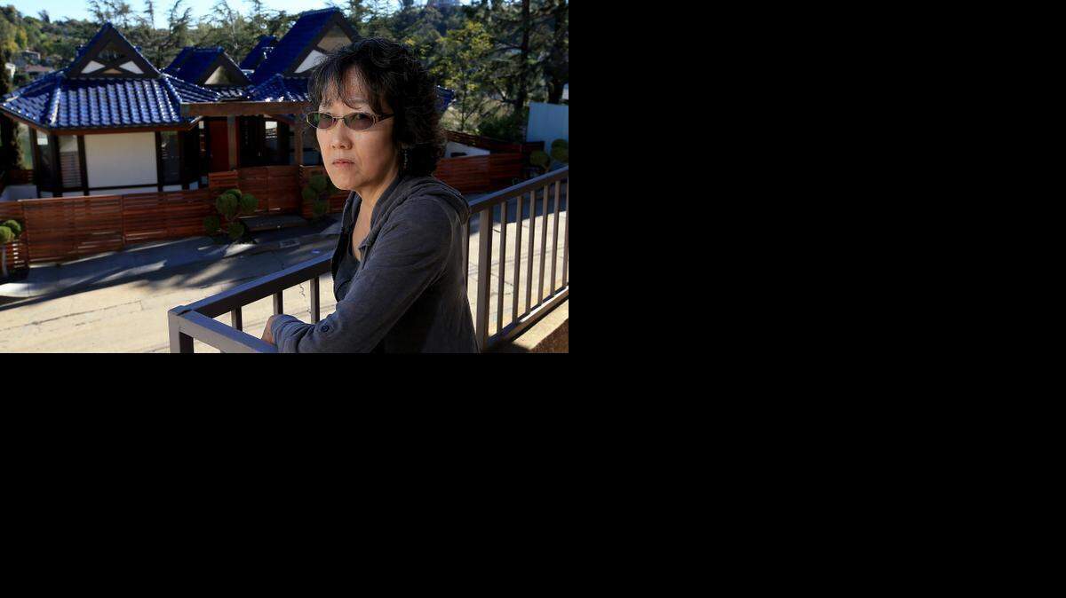 
Jane Taguchi, shown in January, was upset that the house across the street from her was being rented out regularly on Airbnb, even though short-term rentals are barred in her Silver Lake neighborhood of Los Angeles.
