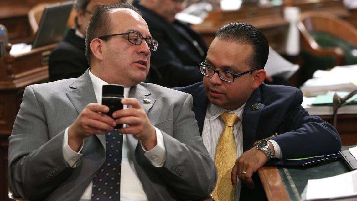 In this May 28, 2014 file photo, Assemblyman Luis Alejo, D-Watsonsville, right, In talks with Assemblyman Raul Bocanegra, D-Los Angeles, during the Assembly session at the Capitol in Sacramento.