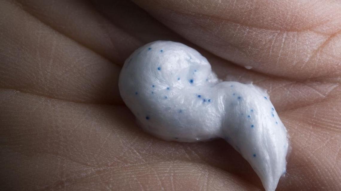 
Researcher Chelsea Rochman holds a dollop of commercially available facial scrub containing microbeads in her lab at UC Davis. The California Senate on Friday approved a scaled-back version of Assembly Bill 888, which would ban the sale of products containing plastic microbeads after 2020. Plastic microbeads have been shown to harm wildlife and oceans.
