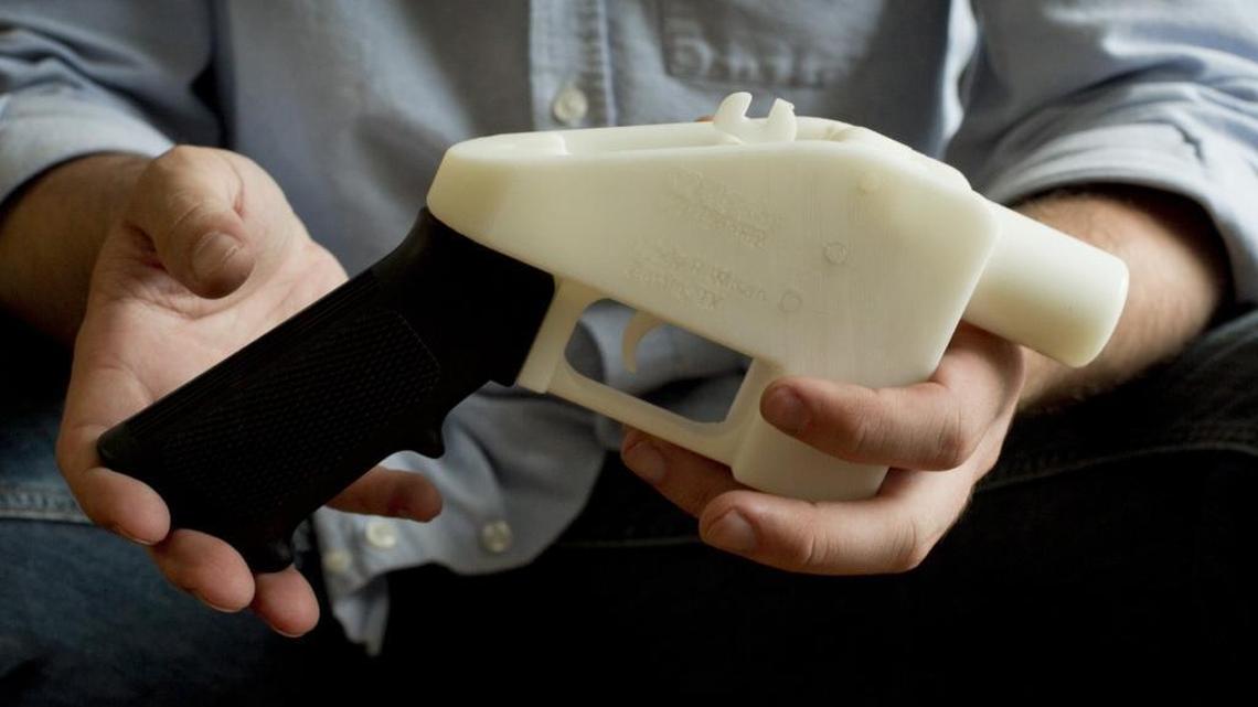 In May 2013, Cody Wilson holds a pistol he calls the “Liberator.” The gun was completely made on a 3D printer at his home in Austin, Texas. His attempt to distribute the plans for printing such firearms led to a three-year lawsuit and later settlement with the federal government.