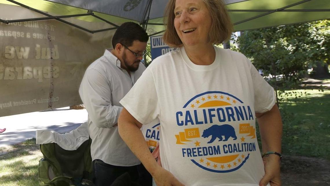 Activist Cindy Sheehan puts on a T-shirt in support of a plan to make California an independent nation on May 19, 2017 in Sacramento. The California Freedom Coalition delivered paperwork to the Attorney General's office to put a initiative on the ballot to make California an independent nation, The group must collect more than 585,000 signatures to qualify for next year's ballot.