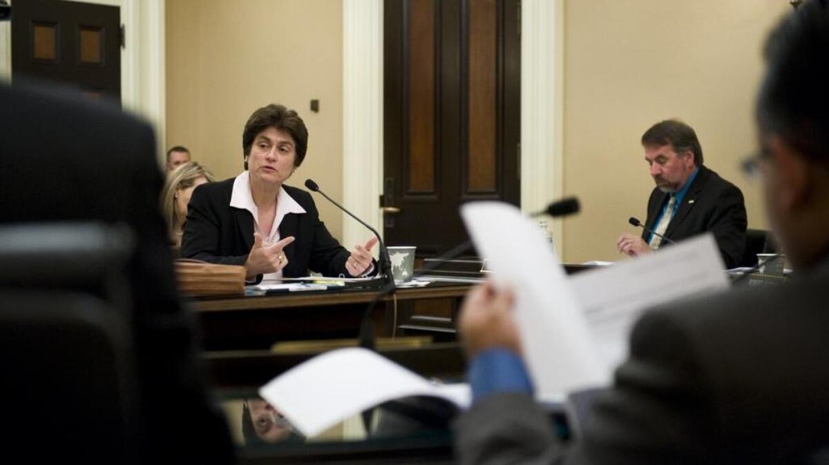 State Auditor Elaine Howle, left, presents her findings on the Commission on Teacher Credentialing to the Joint Legislative Audit Committee at the Capitol, May 10, 2011