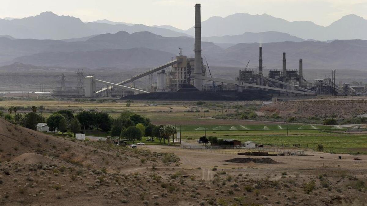 
In this Monday, May 14, 2012, file photo, the Reid-Gardner power station is seen near a farm on the Moapa Indian Reservation, in Moapa, Nev.
