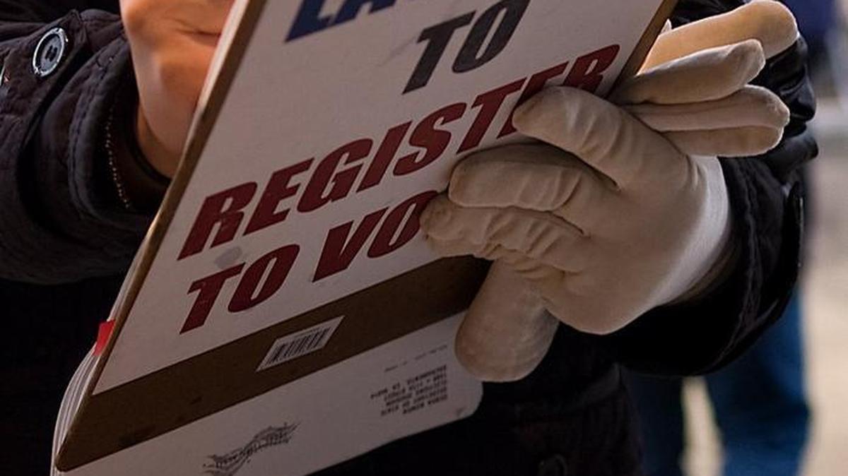 In this 2008 photo, a Sacramento voter registers to vote. Election officials are looking into the possibility that 191 million voter records were publicly posted online, including some from California.